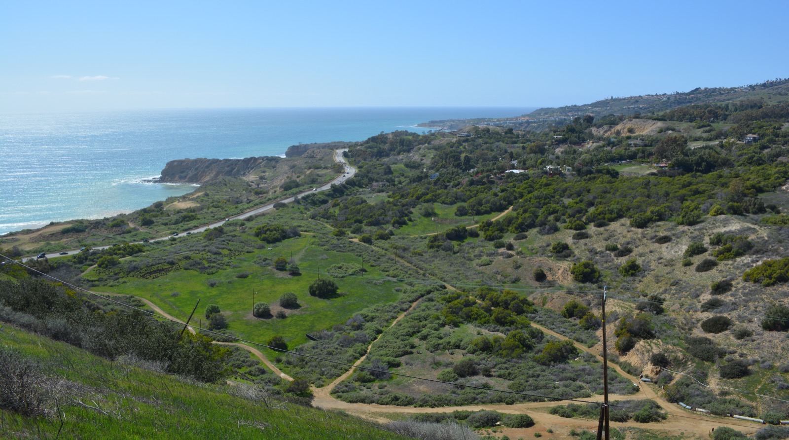 View across the hummocky Portuguese Bend landslide terrain and nature preserve toward Inspiration Point, Portuguese Point, and the Pacific Ocean